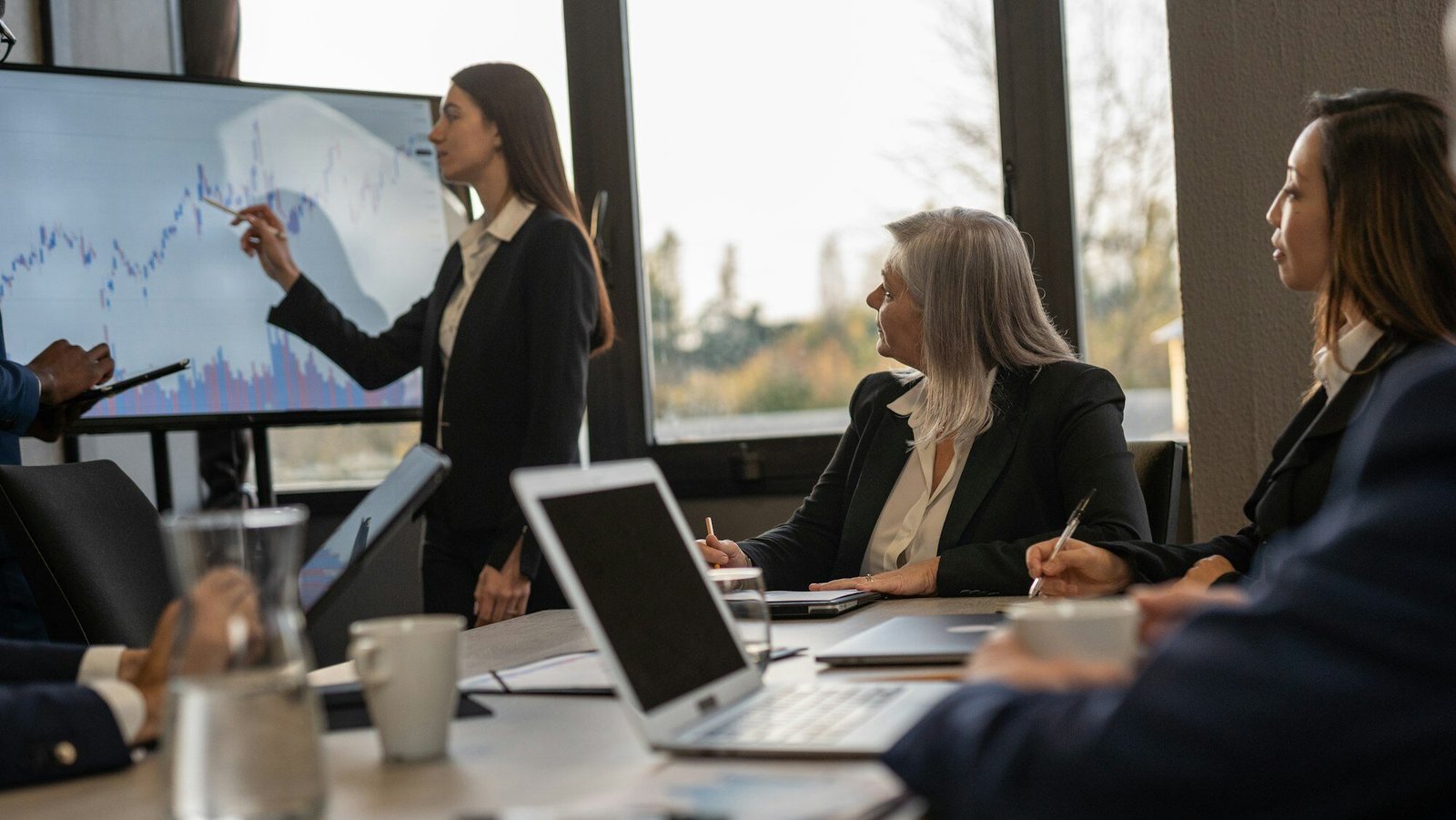 Group of business professionals discussing the latest market trends
