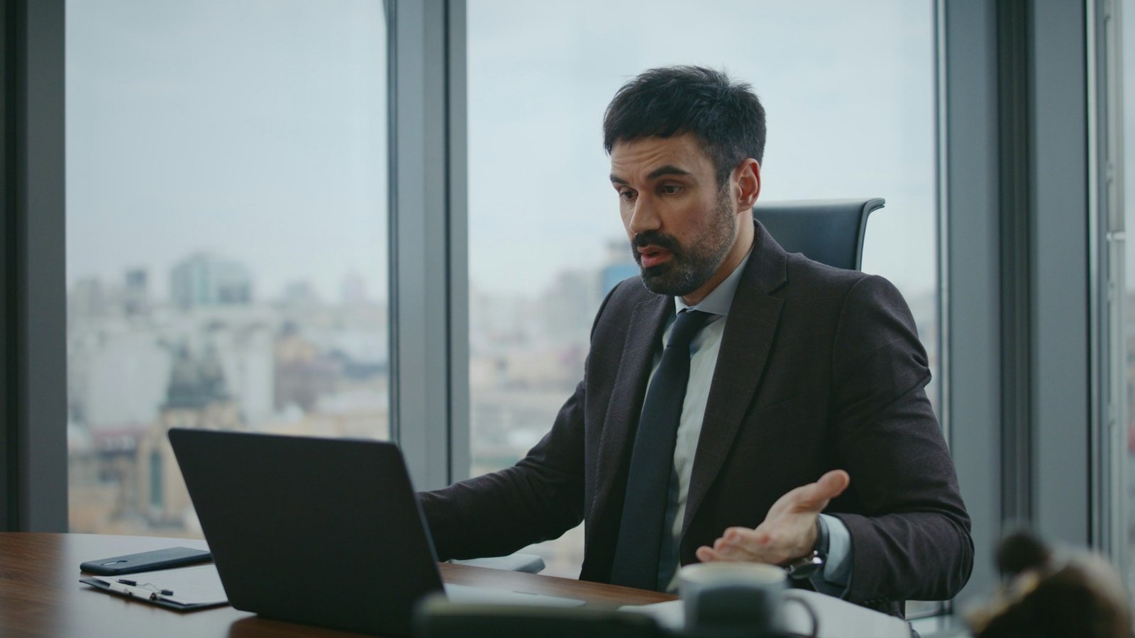 Businessman shouting video conference worried company loss in office close up.