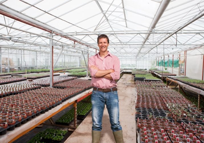 Portrait,Of,Man,Growing,Plants,In,Commercial,Greenhouse