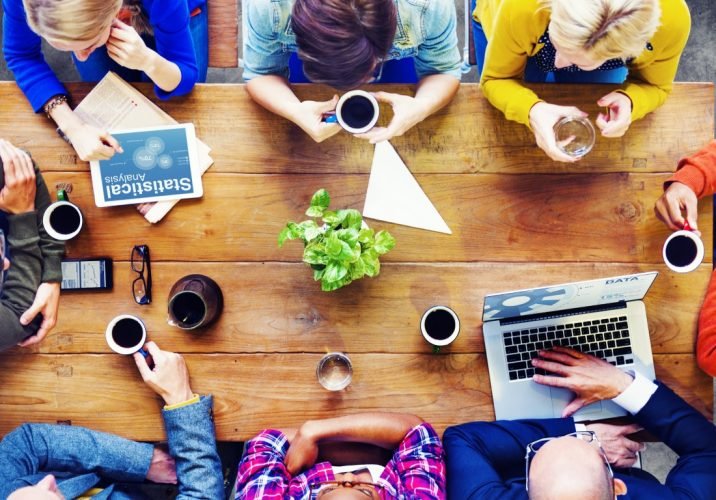 Group,Of,Business,People,Discussing,On,A,Cafe