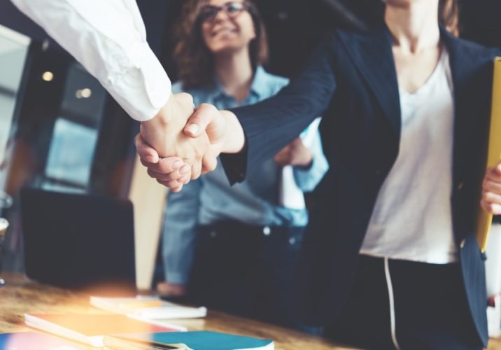 Young,Business,People,Shaking,Hands,In,The,Office.,Finishing,Successful
